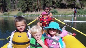 Kids rafting with family on the clark fork river with Montana River Guides