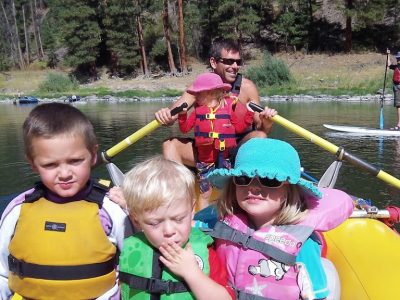 Kids rafting with family on the clark fork river with Montana River Guides